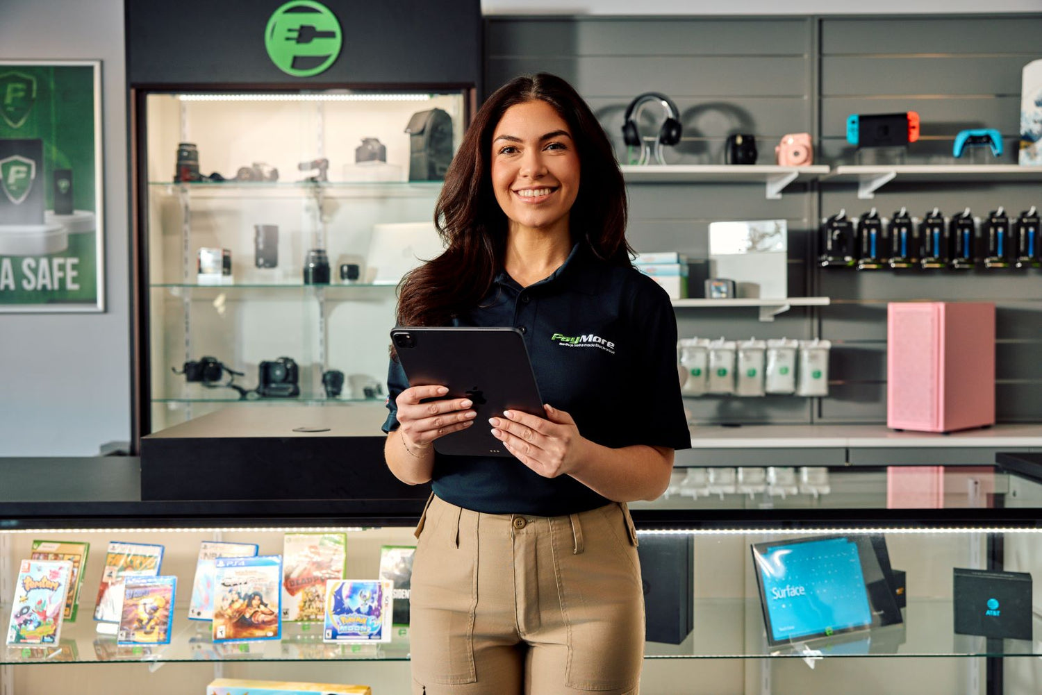 PayMore employee holding iPad