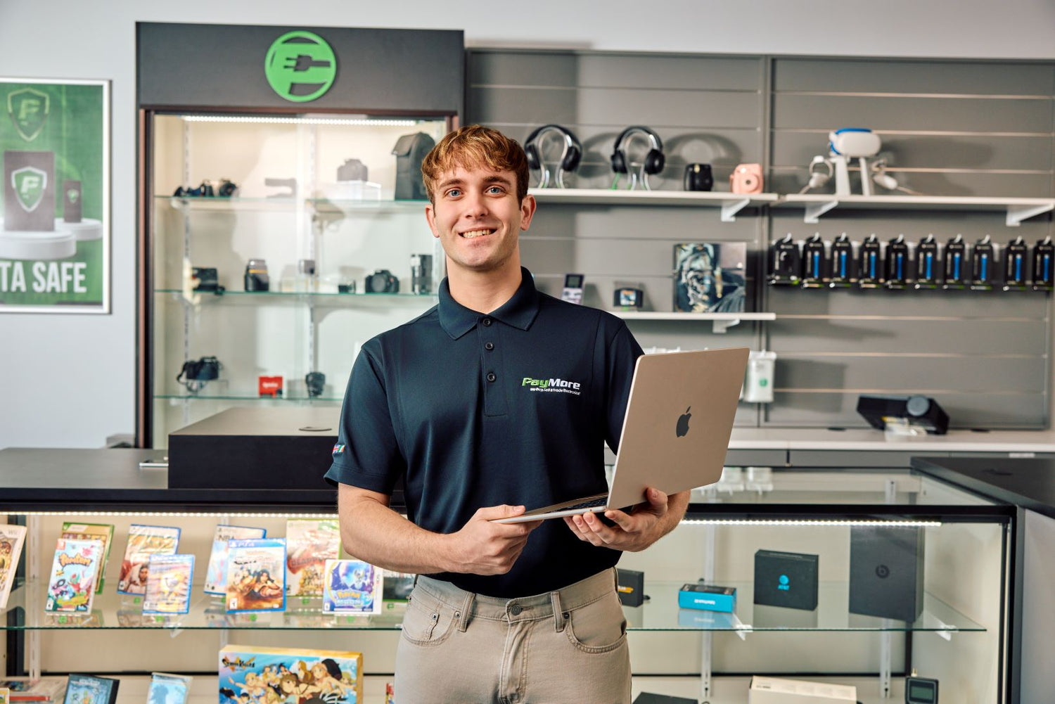 man holding laptop